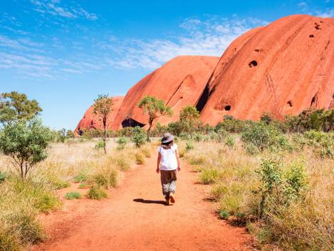 Uluru Kata Tjuta national park Australia - Sept 22, 2016: Woman walking in the red center, Uluru, Northern Territory